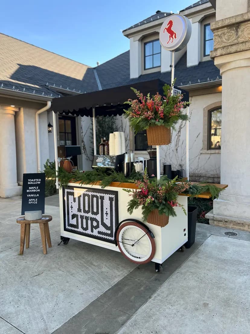Freshly brewed latte with latte art from Giddy Up Coffee Co., Oklahoma’s premier mobile coffee catering service.
